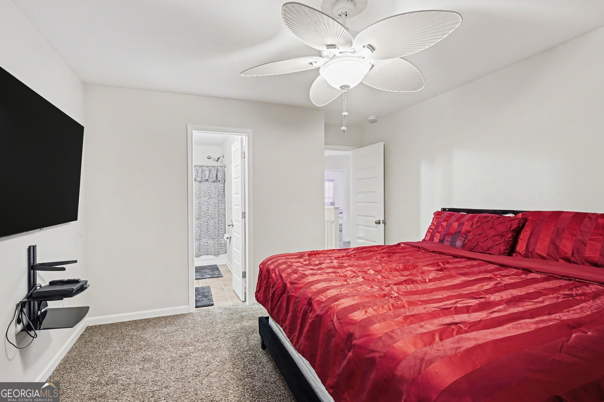 1241 England Terrace Hampton, GA 30228 - Photo 12 of 20 a bedroom with a large bed and a flat screen tv