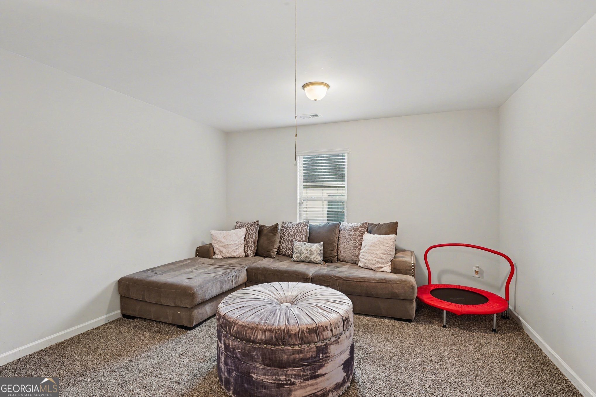 1241 England Terrace Hampton, GA 30228 - Photo 15 of 20 a living room with furniture and a couch