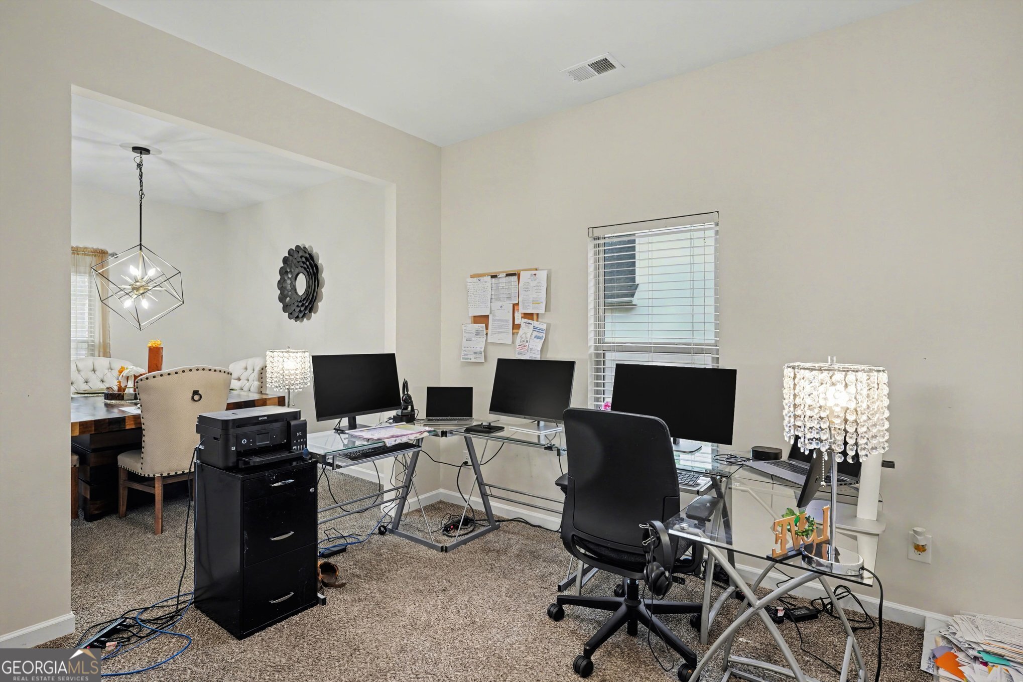1241 England Terrace Hampton, GA 30228 - Photo 2 of 20 a view of a workspace with furniture and a window