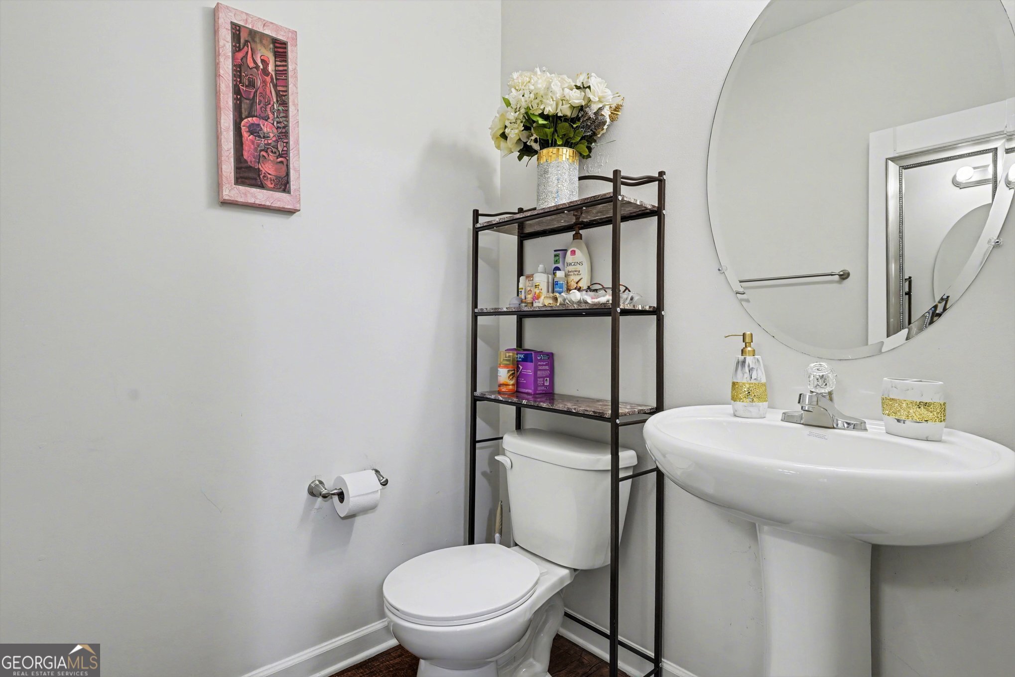 1241 England Terrace Hampton, GA 30228 - Photo 5 of 20 a bathroom with a toilet sink and mirror