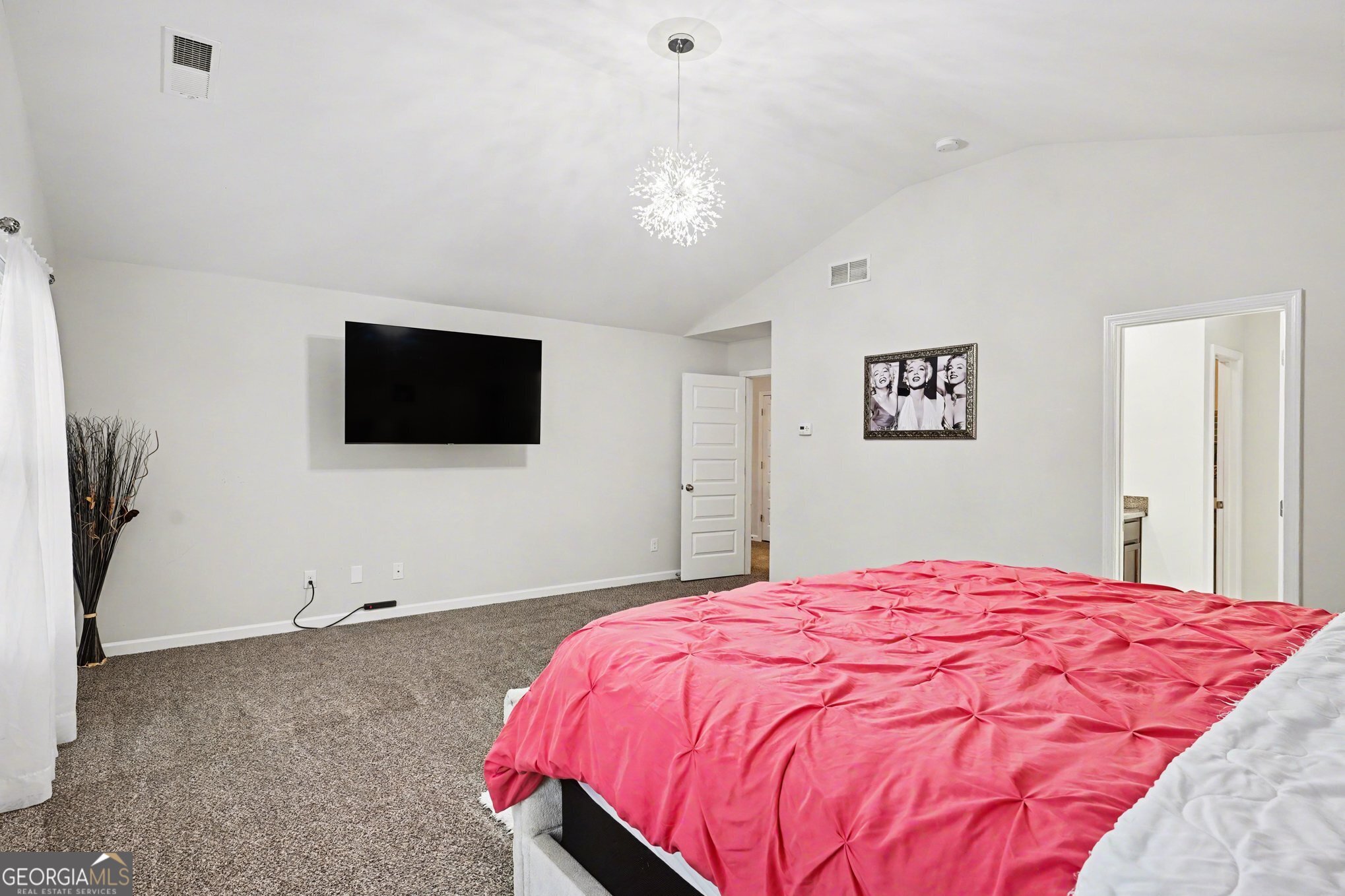 1241 England Terrace Hampton, GA 30228 - Photo 9 of 20 a bedroom with a bed and a flat screen tv