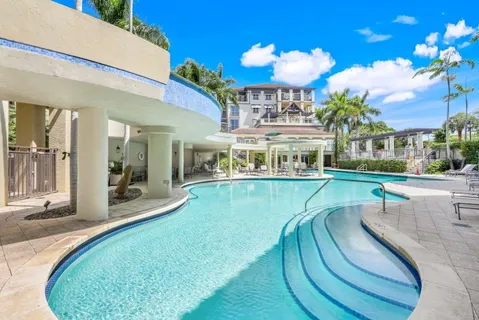 a view of a swimming pool with a patio