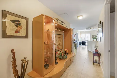 a view of a hallway with dining area