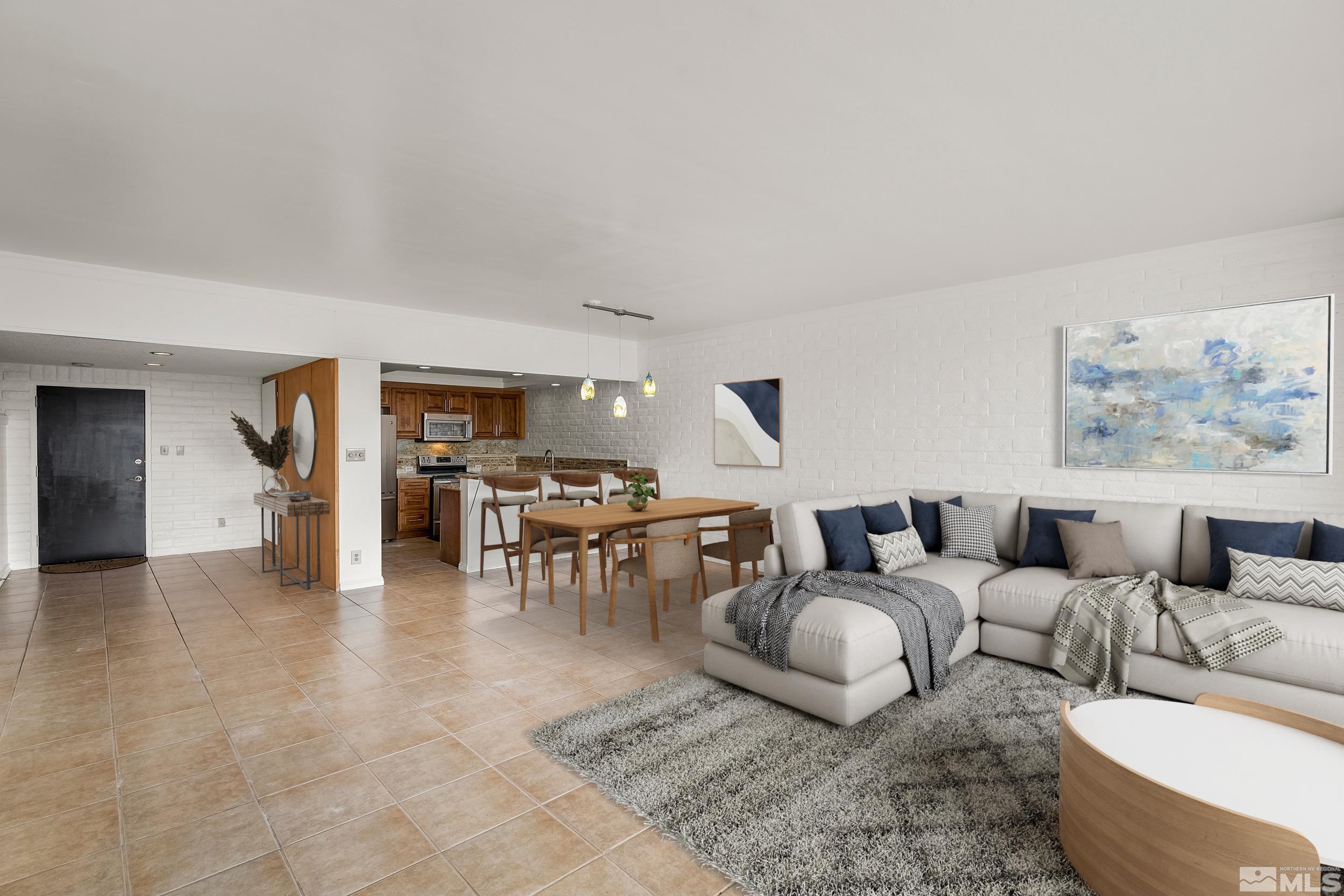 1200 Riverside Drive, Unit #1209 Reno, NV 89503 - Photo 10 of 35 a living room with lots of furniture and view of kitchen