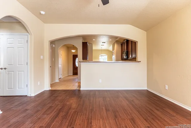 a view of a living room with wooden floor