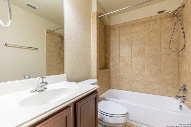 a bathroom with a sink a toilet and a bathtub