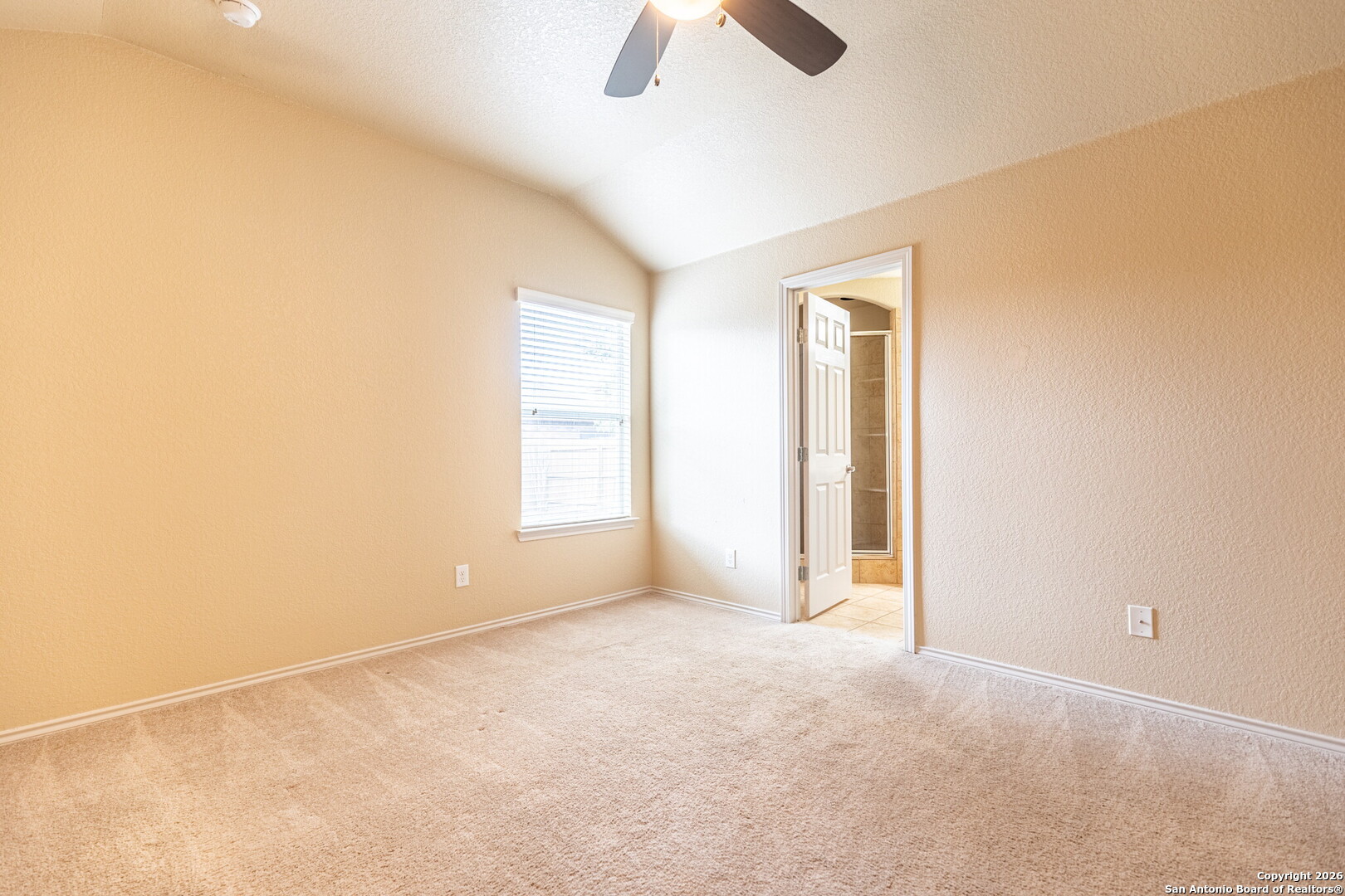3815 Bogie Way Converse, TX 78109 - Photo 22 of 32 an empty room with chandelier fan and windows