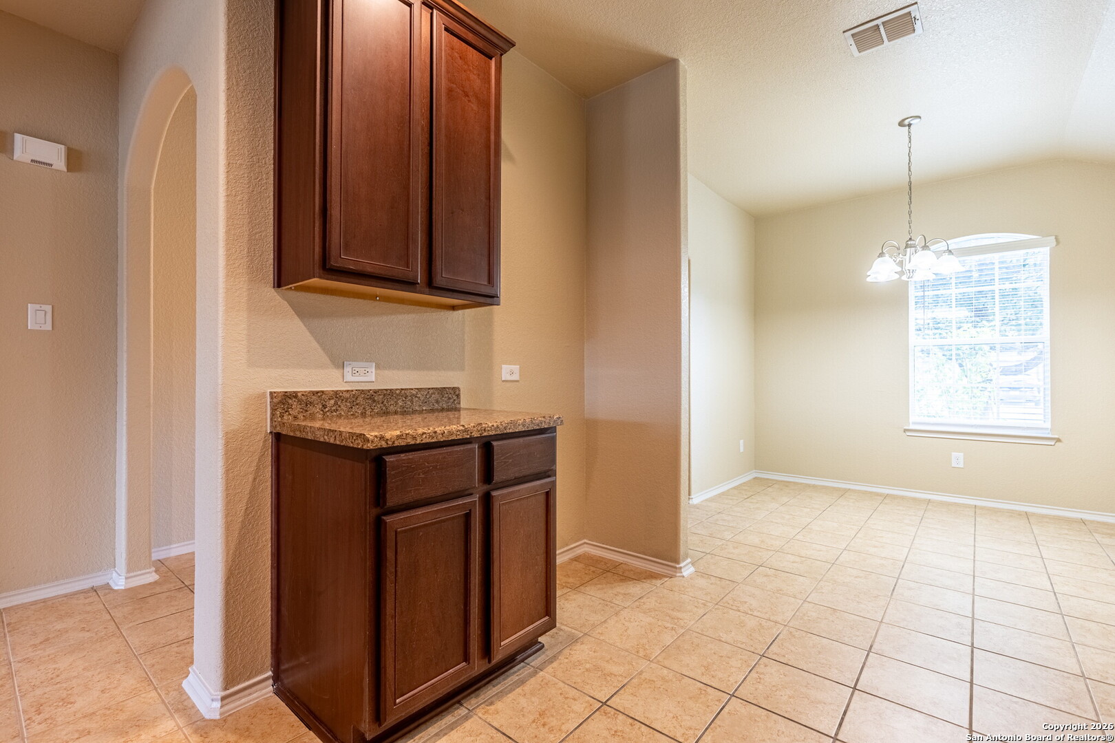 3815 Bogie Way Converse, TX 78109 - Photo 9 of 32 a kitchen with granite countertop a sink and a stove
