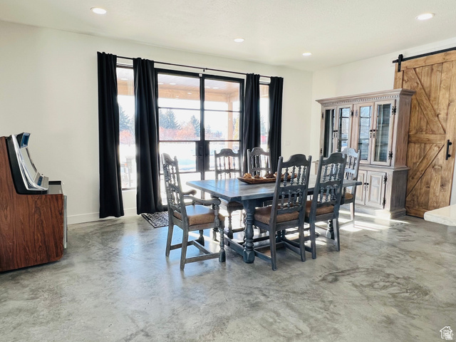 100 Whit Lane Georgetown, ID 83239 - Photo 12 of 76 Dining area featuring a barn door, concrete flooring, and recessed lighting