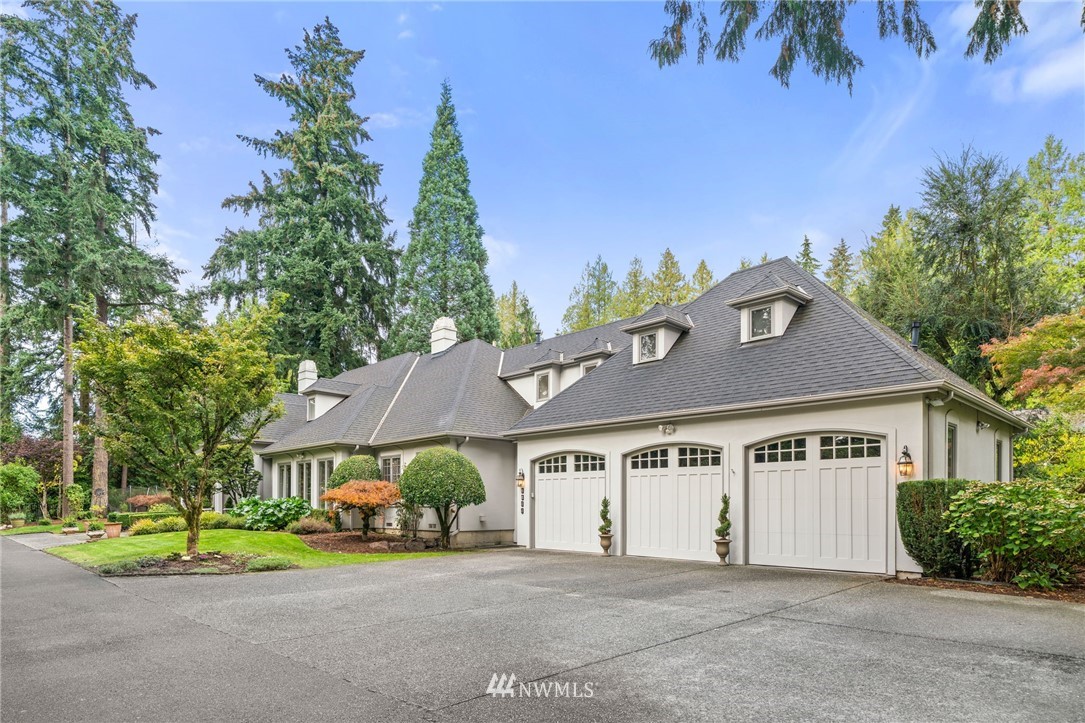 1209 Evergreen Point Road Medina, WA 98039 - Photo 1 of 1 a front view of a house with a garden and plants