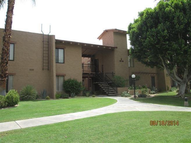1050 Ramon Road, Unit 80 Palm Springs, CA 92264 - Photo 1 of 10 a brick house with a large tree in front of it