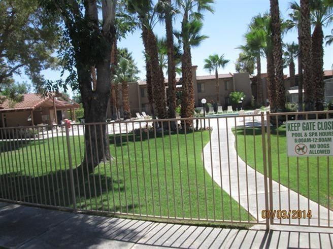 1050 Ramon Road, Unit 80 Palm Springs, CA 92264 - Photo 9 of 10 a view of a house with a backyard and a garden