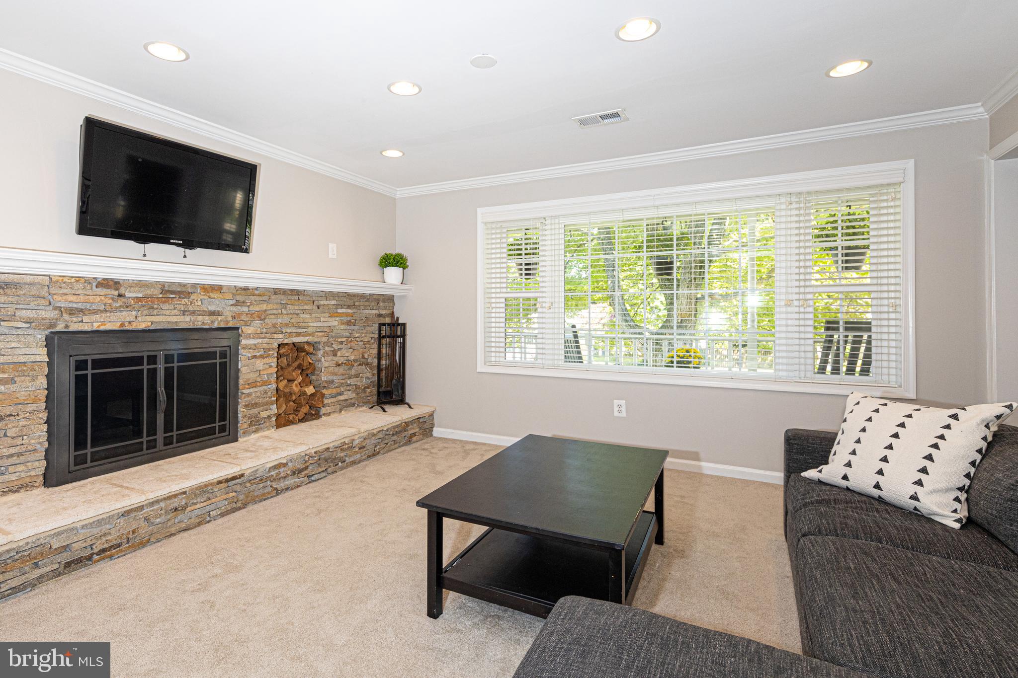 6224 Greeley Boulevard Springfield, VA 22152 - Photo 3 of 44 Main level rec. room with stacked-stone fireplace!