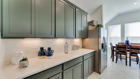 a kitchen with a sink cabinets and stainless steel appliances