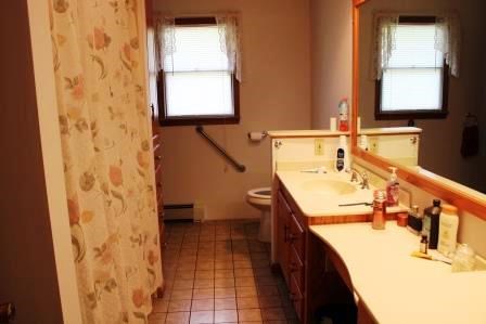 16544 Tionesta Road Pleasantville, PA 16341 - Photo 14 of 32 a bathroom with a sink and a mirror