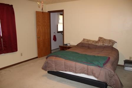 16544 Tionesta Road Pleasantville, PA 16341 - Photo 16 of 32 a bedroom with a bed and a dresser