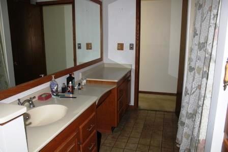 16544 Tionesta Road Pleasantville, PA 16341 - Photo 17 of 32 a bathroom with a sink vanity and mirror