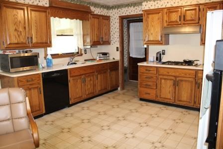 16544 Tionesta Road Pleasantville, PA 16341 - Photo 20 of 32 a kitchen with stainless steel appliances a refrigerator sink and cabinets