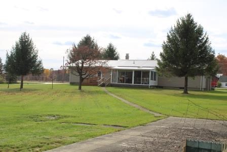 16544 Tionesta Road Pleasantville, PA 16341 - Photo 6 of 32 a front view of a house with a yard