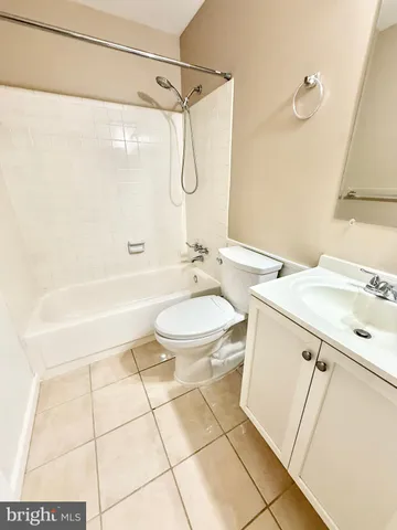 a bathroom with a sink a toilet and a bathtub