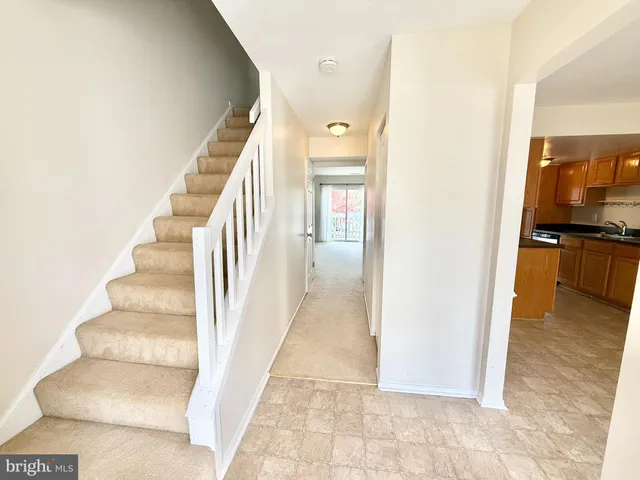 a view of a hallway view with staircase