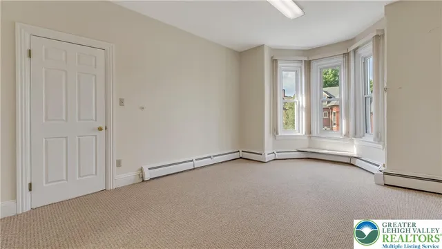 an empty room with window