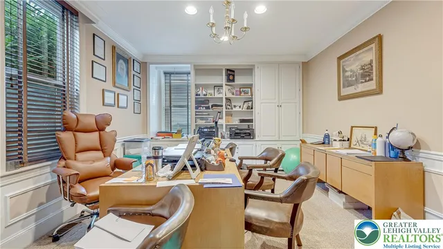 a living room with fireplace furniture and a potted plant