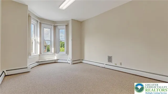 a view of an empty room and window