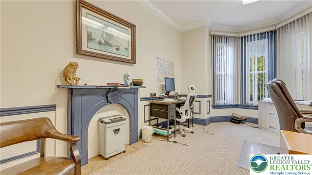 a view of hall way with furniture and mirror