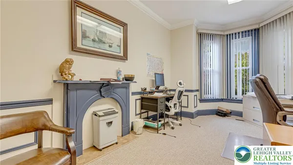 a view of hall way with furniture and mirror