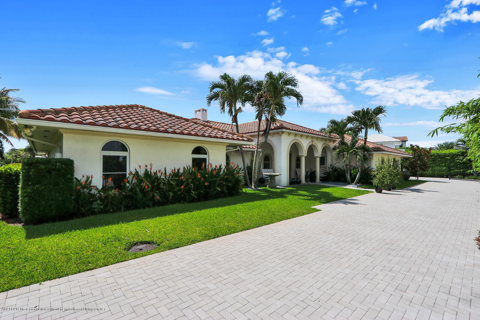 95 Spoonbill Road Manalapan, FL 33462 - Photo 1 of 32 a view of a house with a yard and potted plants