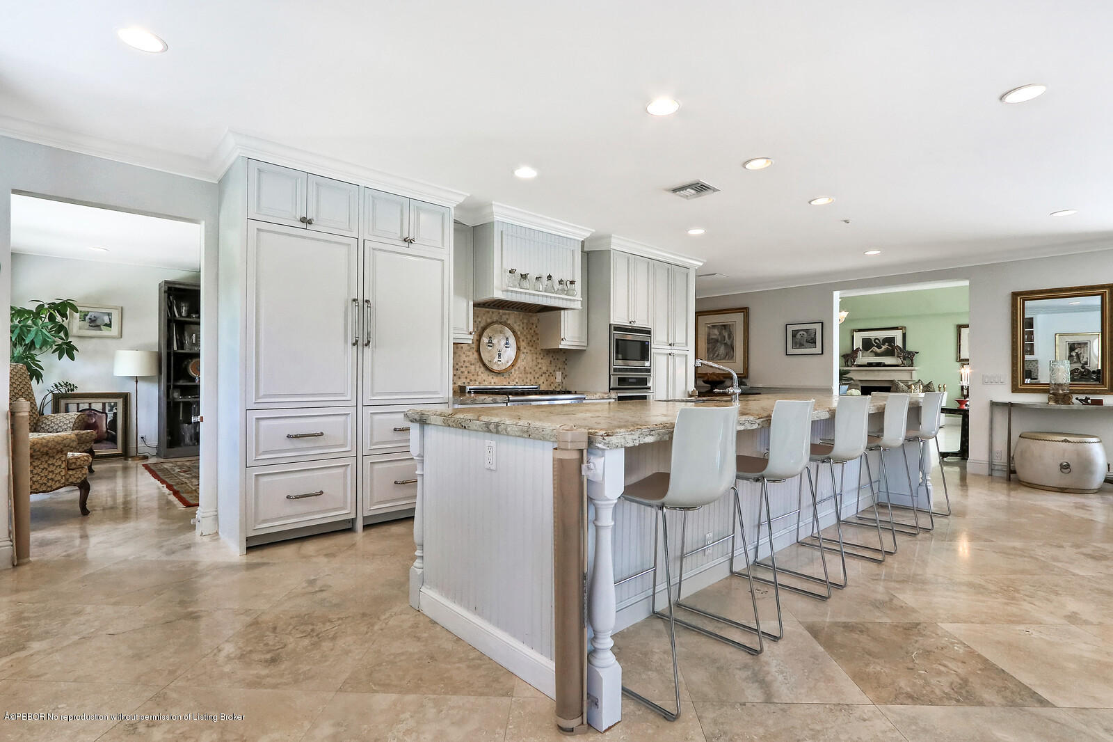 95 Spoonbill Road Manalapan, FL 33462 - Photo 12 of 32 a large kitchen with white cabinets and stainless steel appliances