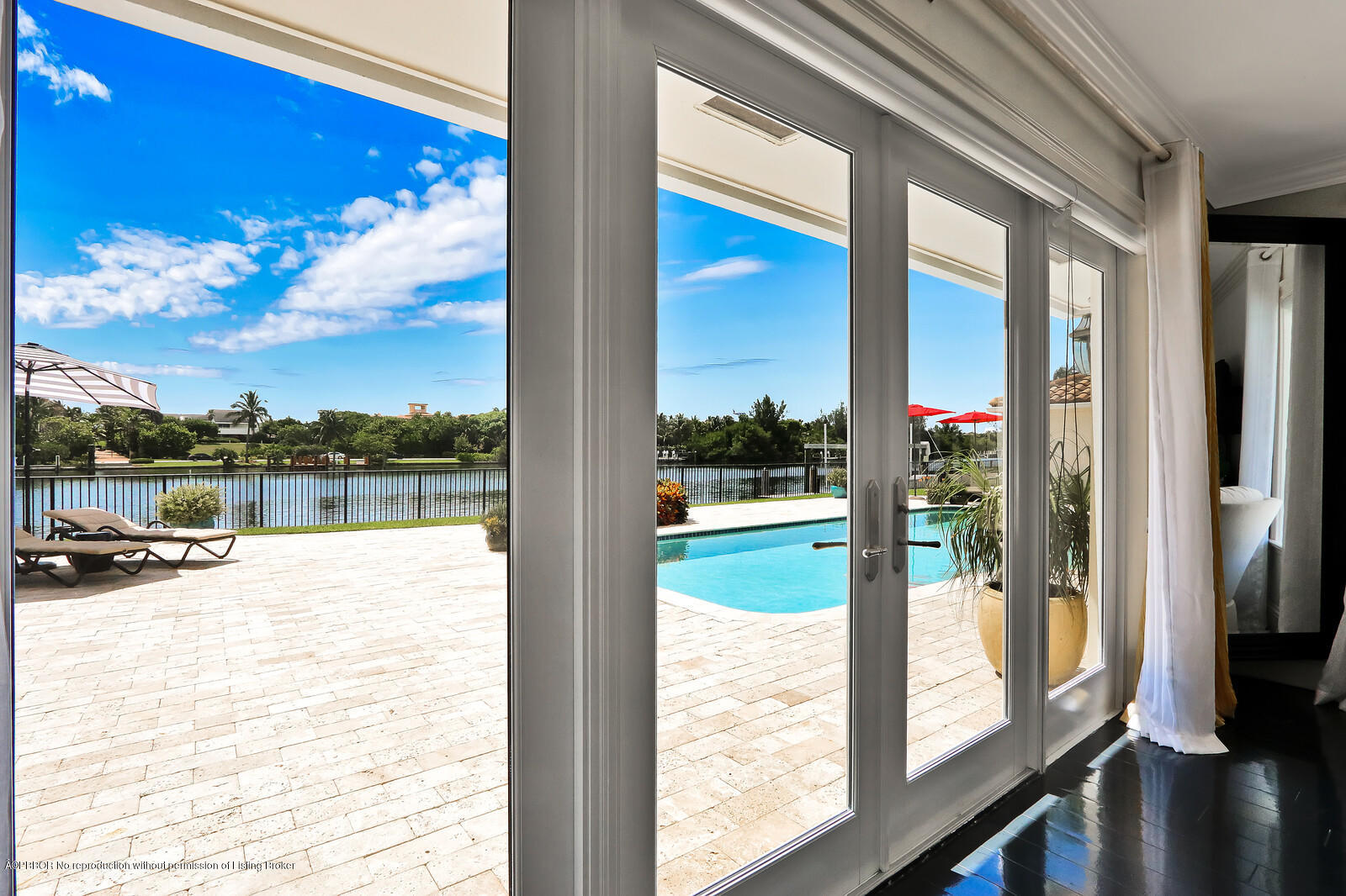 95 Spoonbill Road Manalapan, FL 33462 - Photo 21 of 32 a view of a living room and floor to ceiling window or lake
