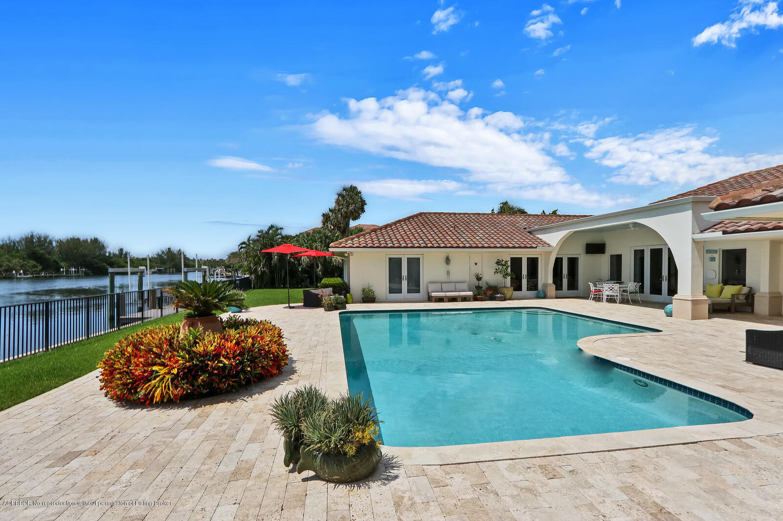 95 Spoonbill Road Manalapan, FL 33462 - Photo 28 of 32 a view of a house with backyard outdoor seating area and furniture