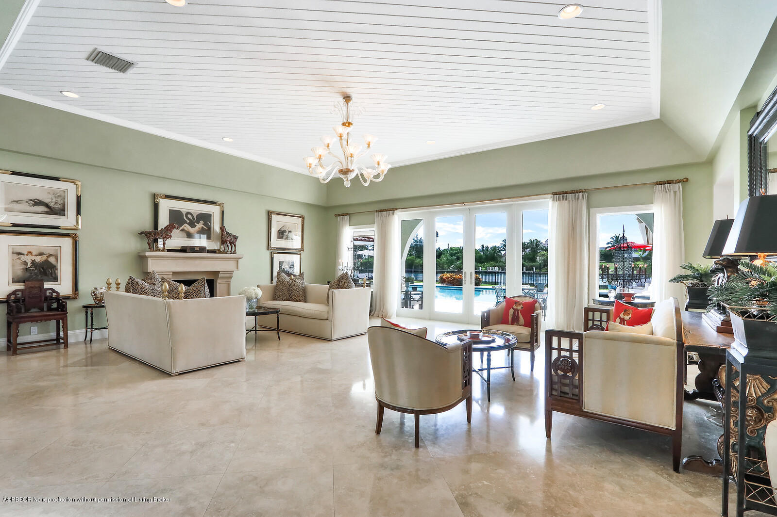 95 Spoonbill Road Manalapan, FL 33462 - Photo 10 of 32 a living room with furniture and a chandelier