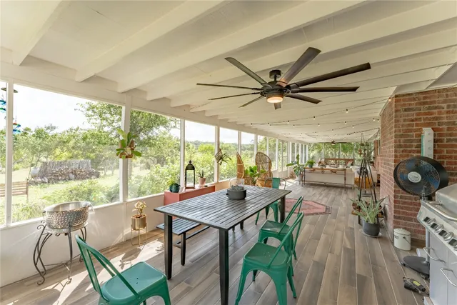 a view of a dining room with furniture window and outside view