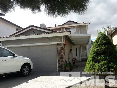 6980 Peppermint Drive Reno, NV 89506 - Photo 1 of 1 a front view of a house with garden