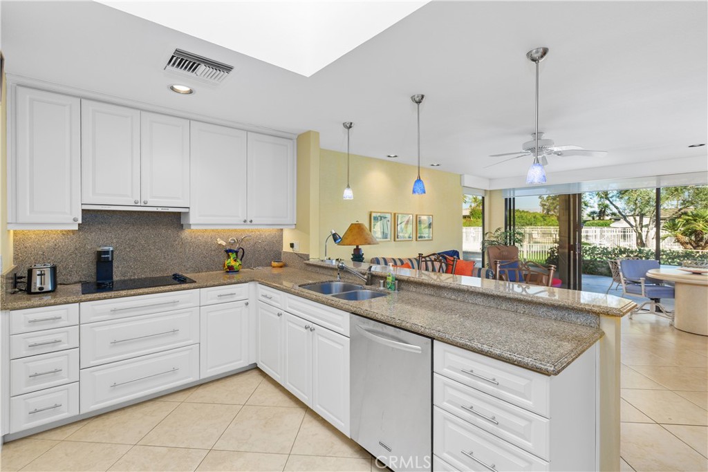 5 Princeton Drive Rancho Mirage, CA 92270 - Photo 13 of 27 a kitchen with sink and cabinets