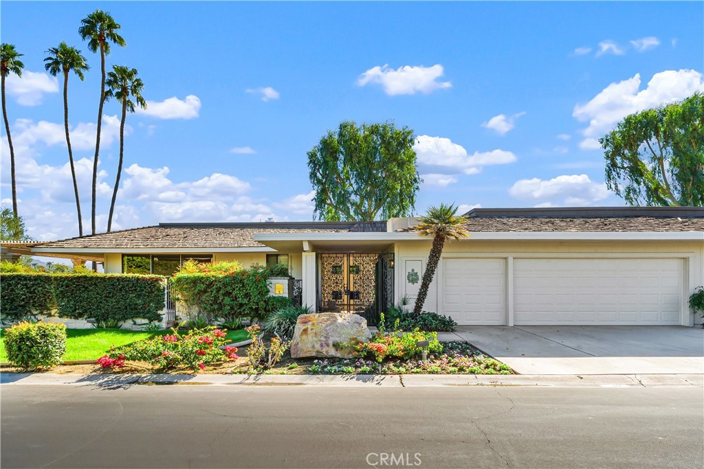5 Princeton Drive Rancho Mirage, CA 92270 - Photo 20 of 27 a front view of a house with garden