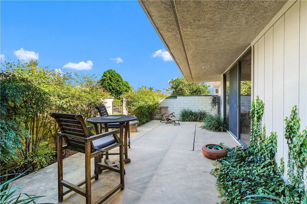 5 Princeton Drive Rancho Mirage, CA 92270 - Photo 5 of 27 a patio with table and chairs and potted plants