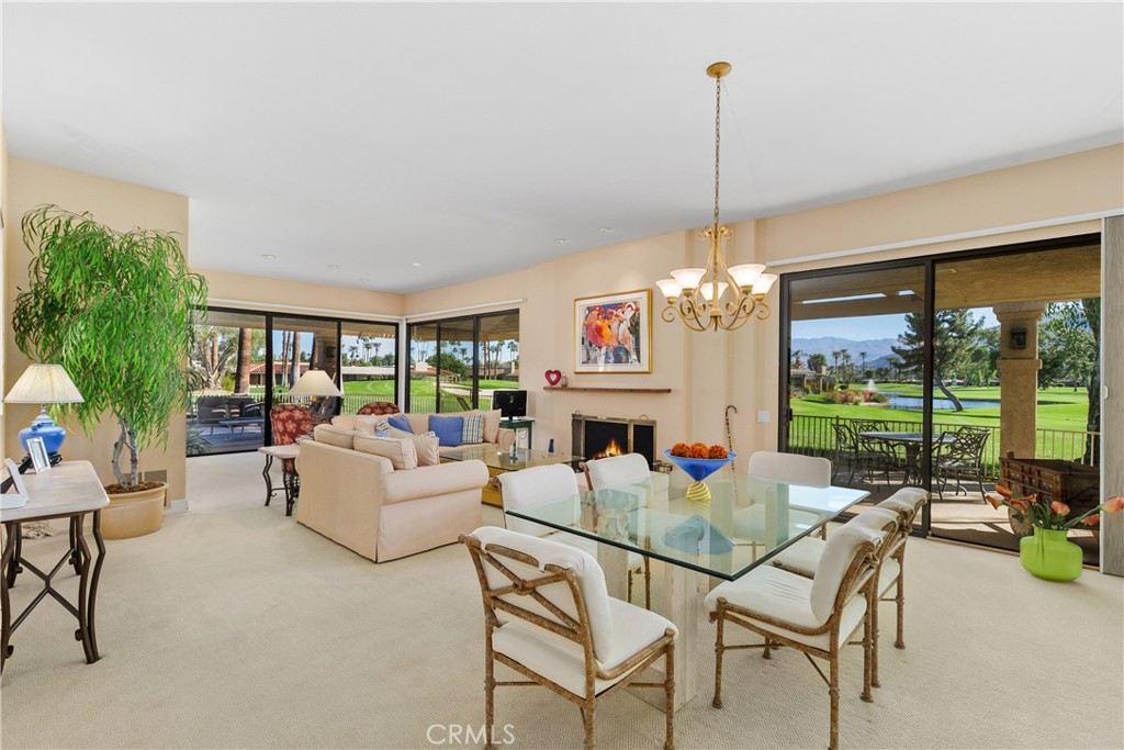 5 Princeton Drive Rancho Mirage, CA 92270 - Photo 7 of 27 a living room with furniture and a chandelier