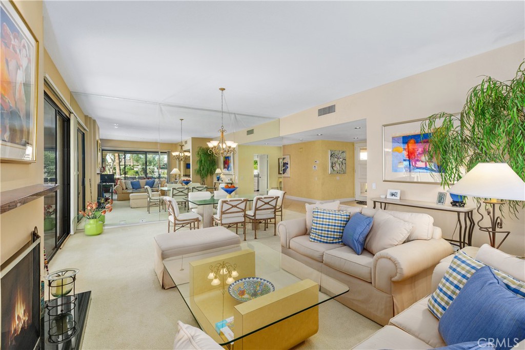 5 Princeton Drive Rancho Mirage, CA 92270 - Photo 9 of 27 a living room with furniture and a flat screen tv