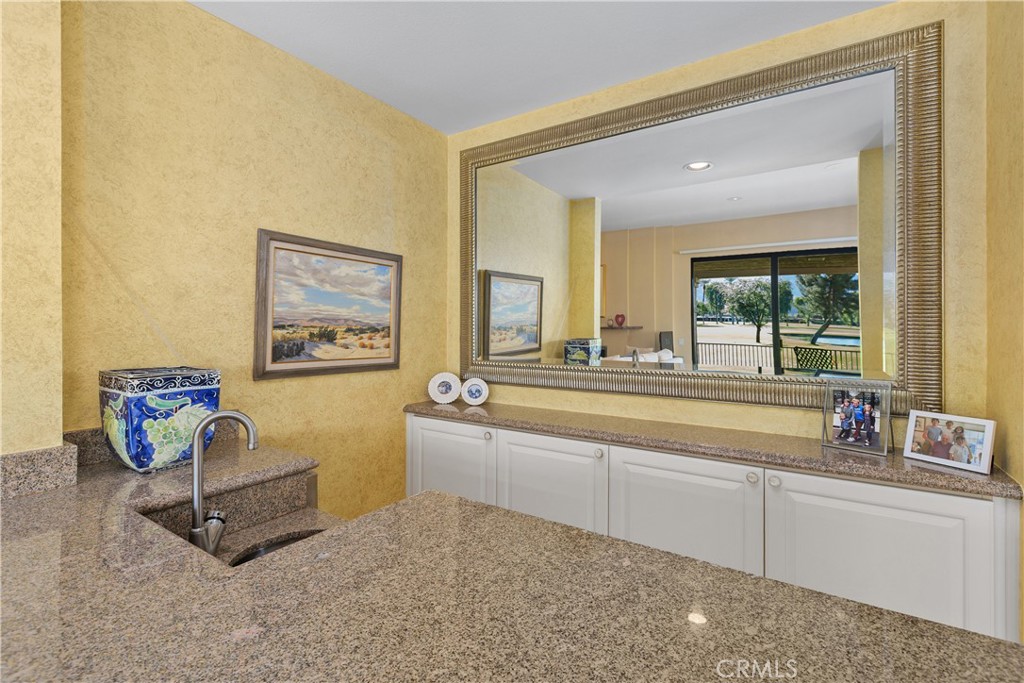 5 Princeton Drive Rancho Mirage, CA 92270 - Photo 10 of 27 a living room with furniture and a large window