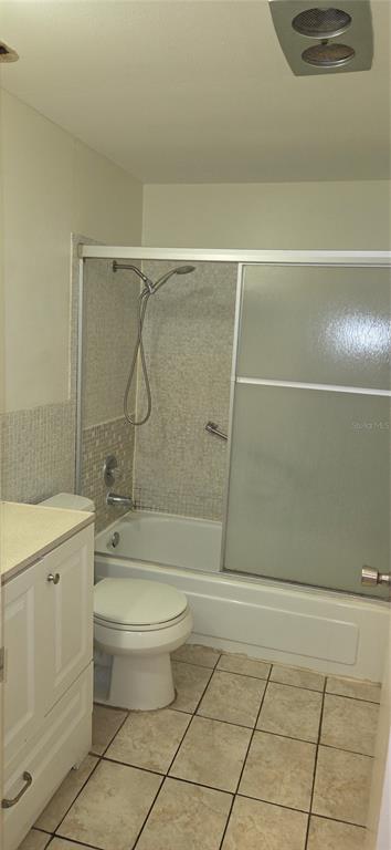 911 Washington Avenue Southwest, Unit 304 Largo, FL 33770 - Photo 19 of 26 a bathroom with a toilet a sink and shower