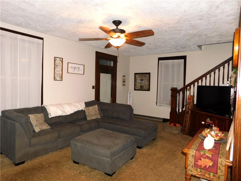235 Ridge Road Brownsville, PA 15417 - Photo 14 of 42 a living room with furniture a flat screen tv and a window