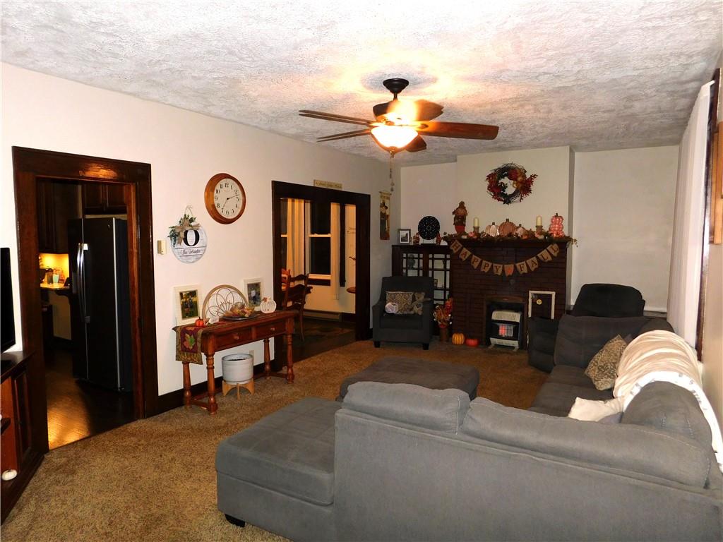 235 Ridge Road Brownsville, PA 15417 - Photo 15 of 42 a living room with furniture chandelier and a window