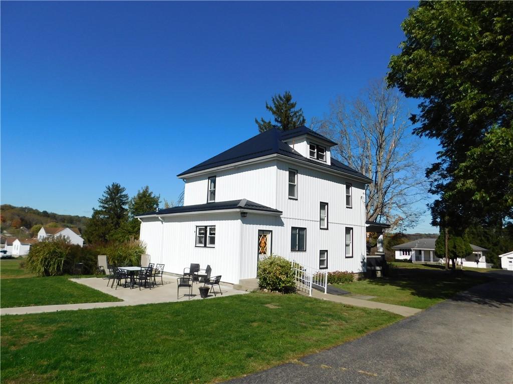 235 Ridge Road Brownsville, PA 15417 - Photo 2 of 42 a front view of a house with a yard