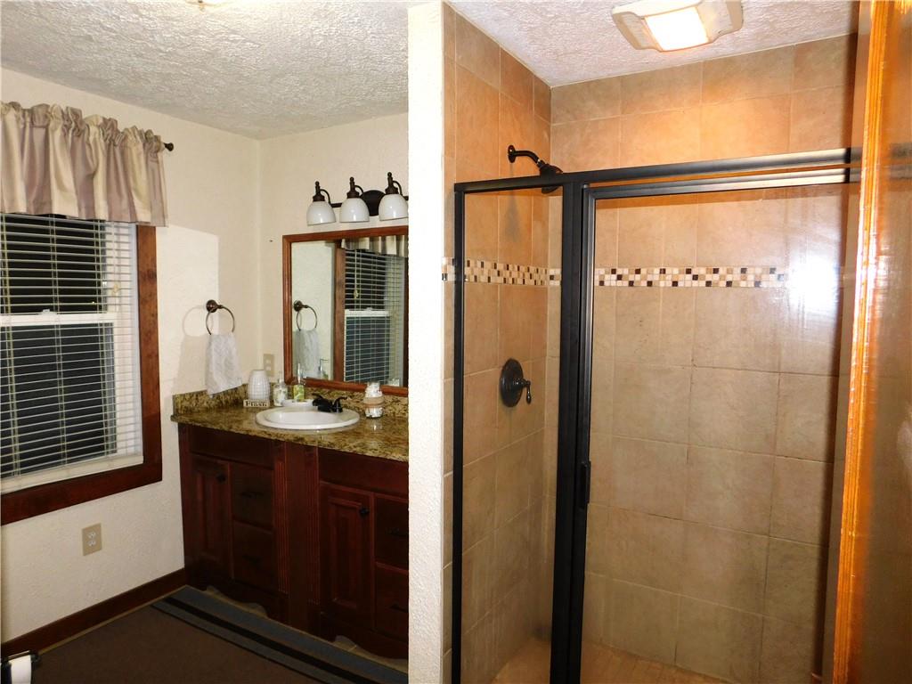 235 Ridge Road Brownsville, PA 15417 - Photo 22 of 42 a bathroom with a double vanity sink and mirror