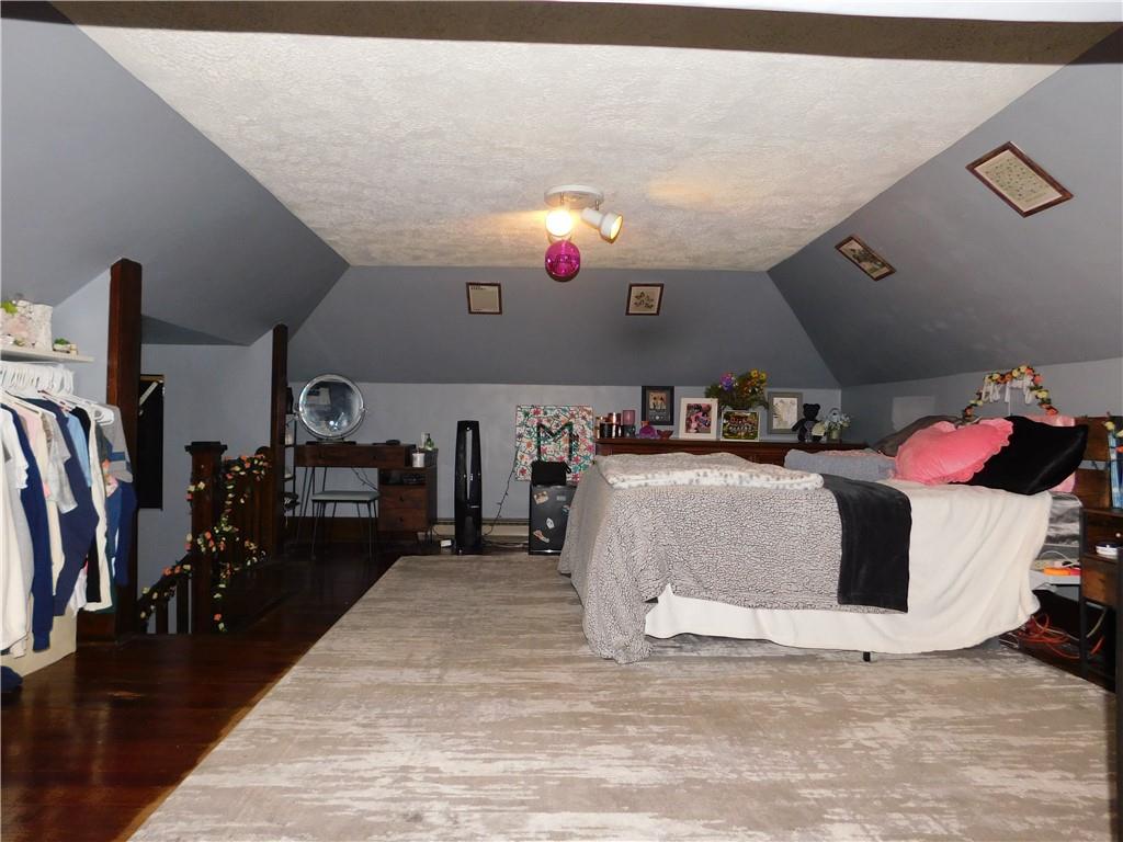235 Ridge Road Brownsville, PA 15417 - Photo 23 of 42 a living room with lots of furniture and a wooden floor
