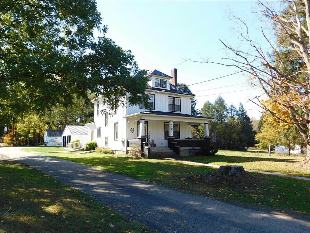 235 Ridge Road Brownsville, PA 15417 - Photo 39 of 42 a front view of a house with a garden and trees